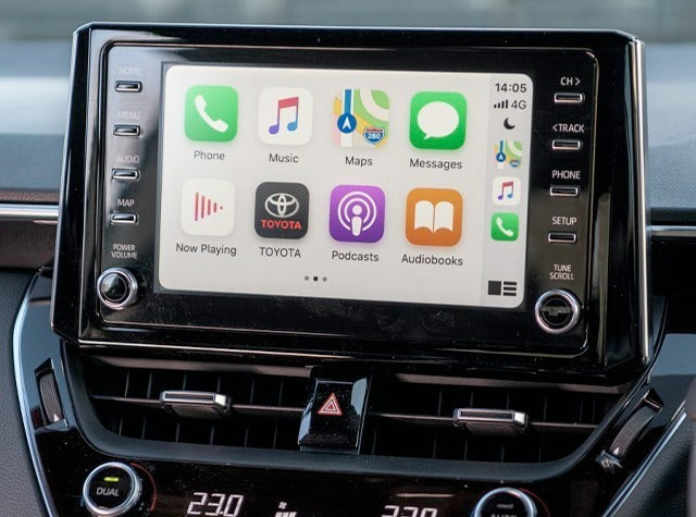 Apple CarPlay interface seamlessly integrated into a Toyota vehicle, featuring navigation, communication, and media apps on the touchscreen display.