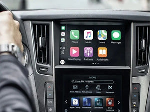 Infiniti's Apple CarPlay interface displayed on the vehicle's touchscreen, featuring navigation, communication, and media app icons.