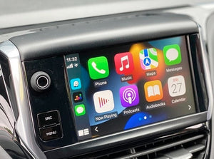 Apple CarPlay interface seamlessly integrated into a Peugeot vehicle, featuring navigation, communication, and media apps on the touchscreen display.