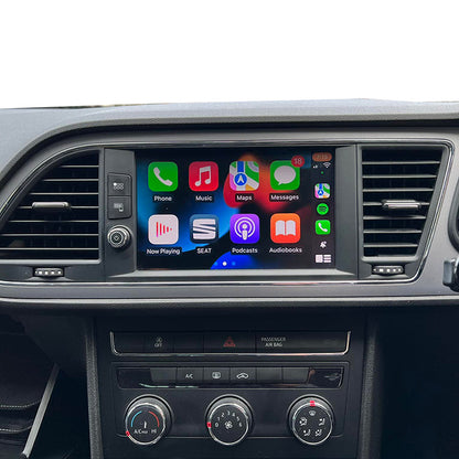 Car dashboard with a touchscreen display showing various app icons.