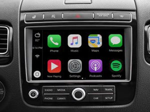 Apple CarPlay interface integrated into a Volkswagen vehicle, showcasing navigation, communication features, and media apps on the touchscreen display.